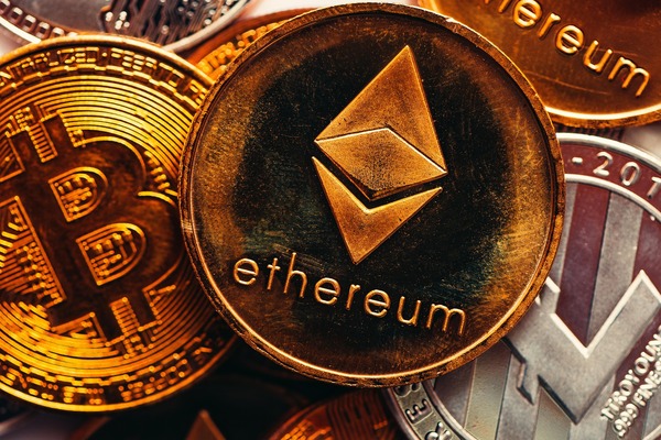 Gold Bitcoin and Ethereum coins close-up