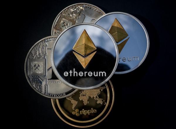 Ethereum coins stacked on a dark surface