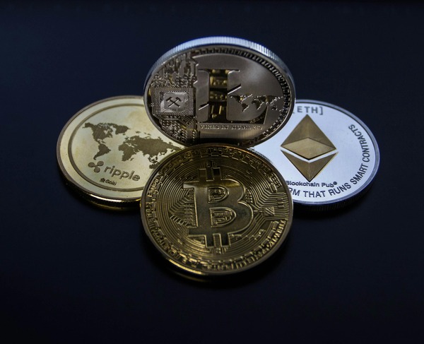 Several crypto coins compared side by side on a dark surface